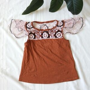 Anthropologie brown blouse with crochet sleeves